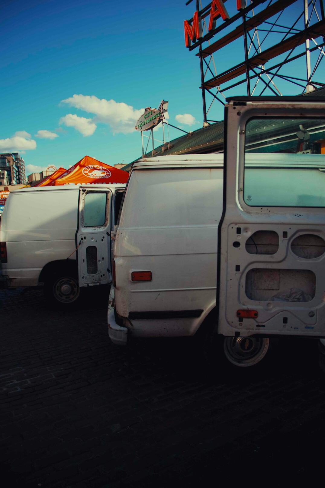 Outside broadcast van with satellite dish and cables at a live event